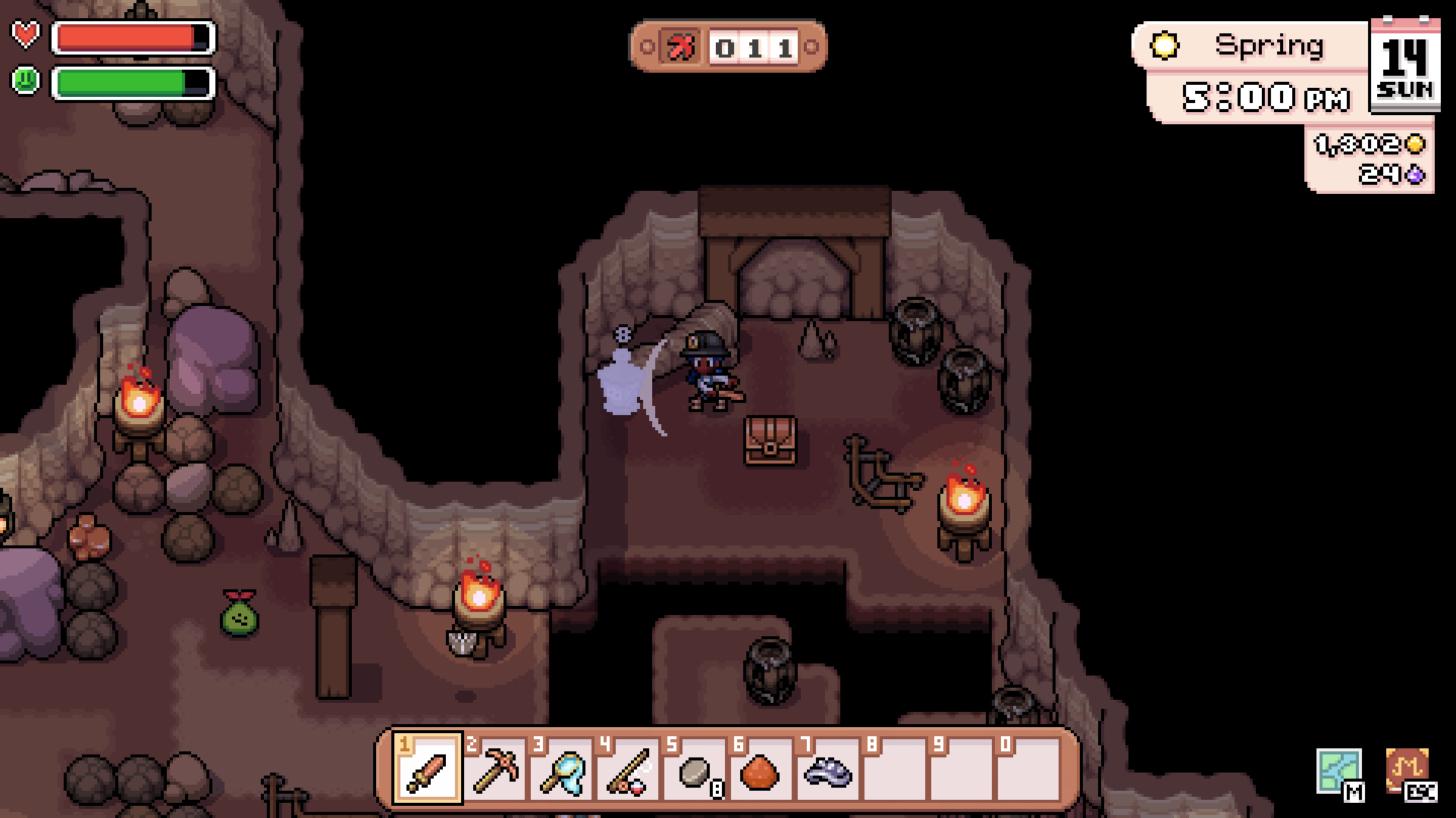 A mine chamber with a treasure chest and mining tools in Fields of Mistria